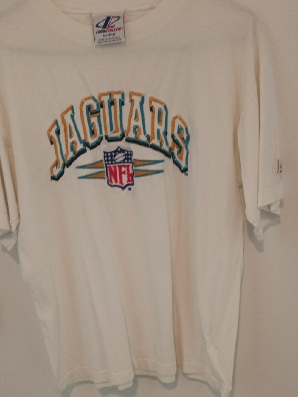 Logo Athletic Cream Jaguars Tee with Teal & Gold Lettering